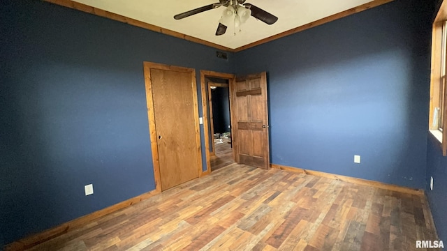 unfurnished bedroom featuring ceiling fan and light hardwood / wood-style floors