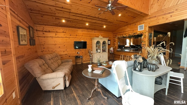 living room featuring ceiling fan, wood ceiling, wooden walls, dark hardwood / wood-style floors, and vaulted ceiling