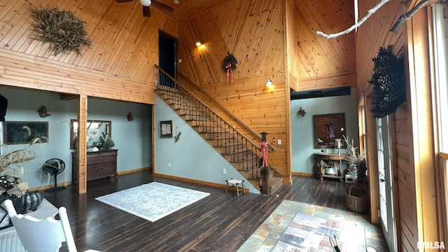 interior space featuring wood ceiling, dark hardwood / wood-style floors, and high vaulted ceiling