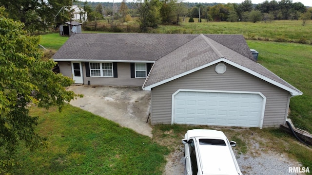 view of front of house with a front lawn and a storage shed