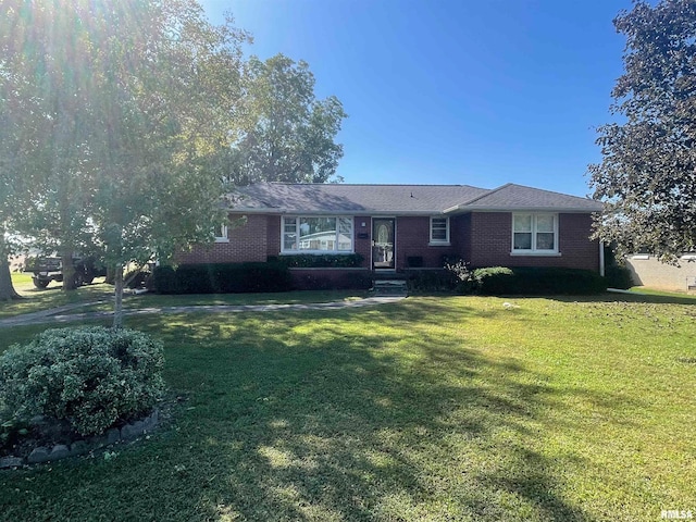 single story home featuring a front lawn