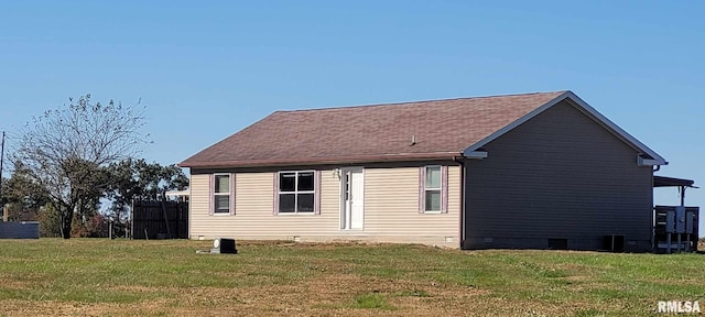 back of house with a yard