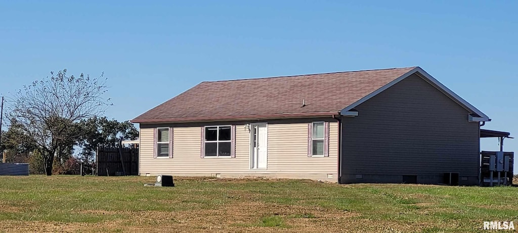 back of house with a yard