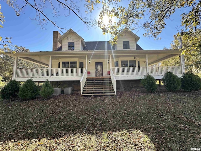 country-style home featuring covered porch