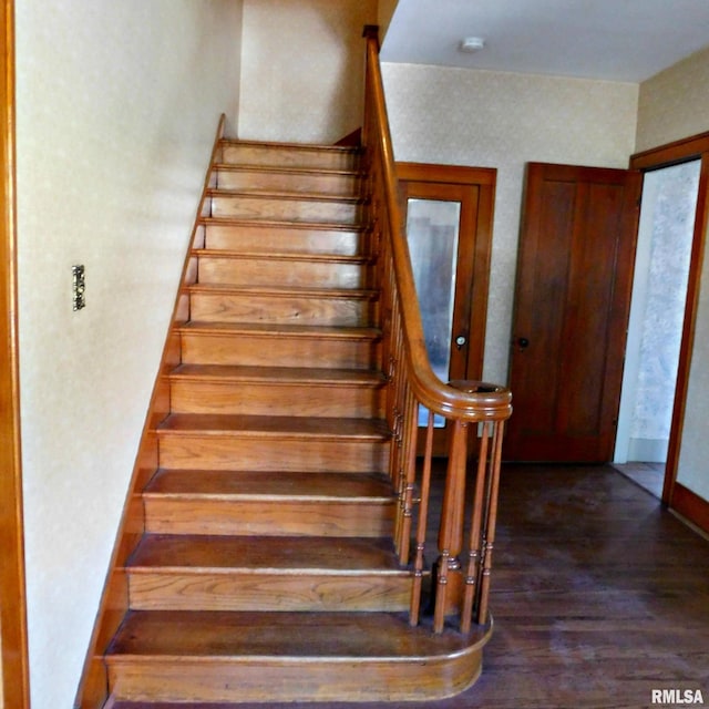 staircase featuring wood-type flooring