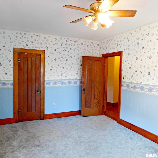 unfurnished bedroom featuring ceiling fan and light colored carpet