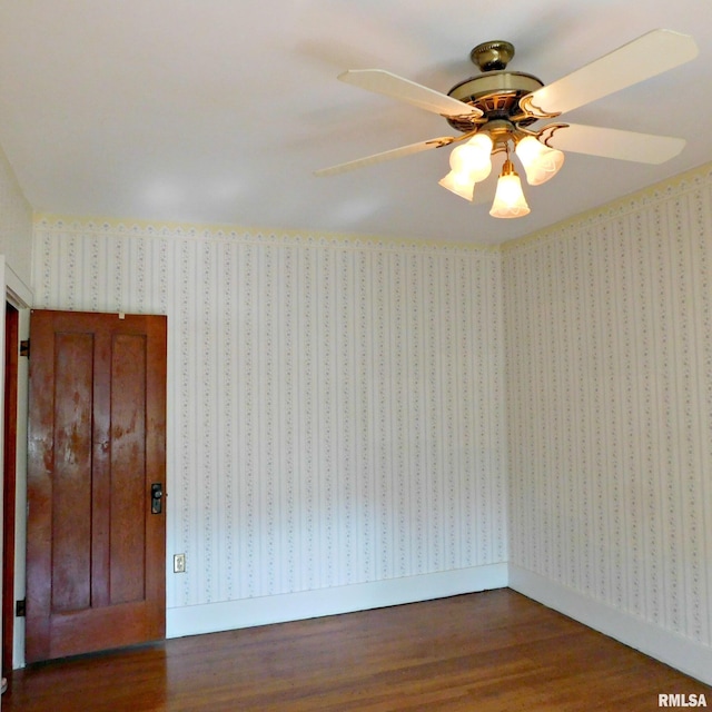 unfurnished room featuring ceiling fan and dark hardwood / wood-style floors