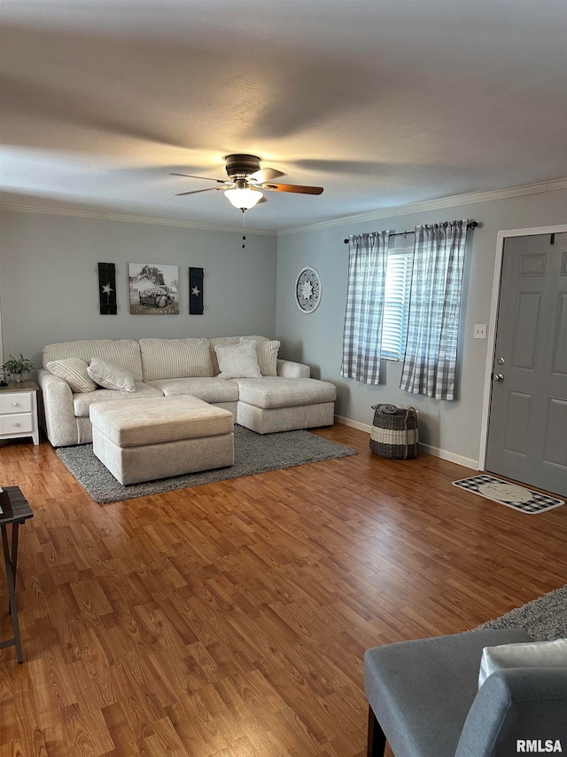 living room with ceiling fan, crown molding, and hardwood / wood-style floors