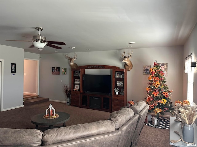 carpeted living room with ceiling fan