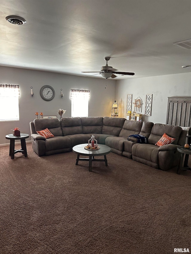 carpeted living room with ceiling fan