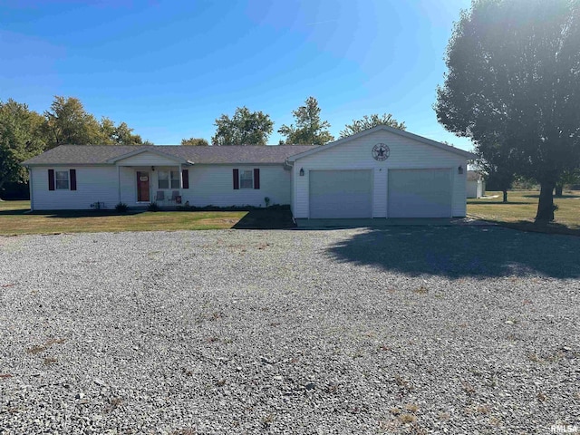 ranch-style house with a front yard and a garage