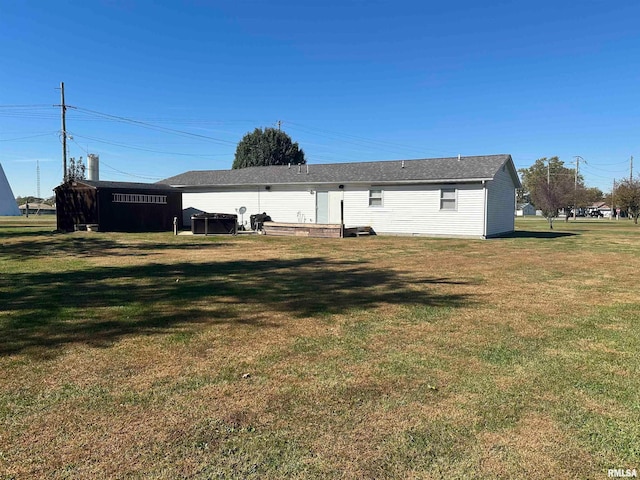 back of house with a yard