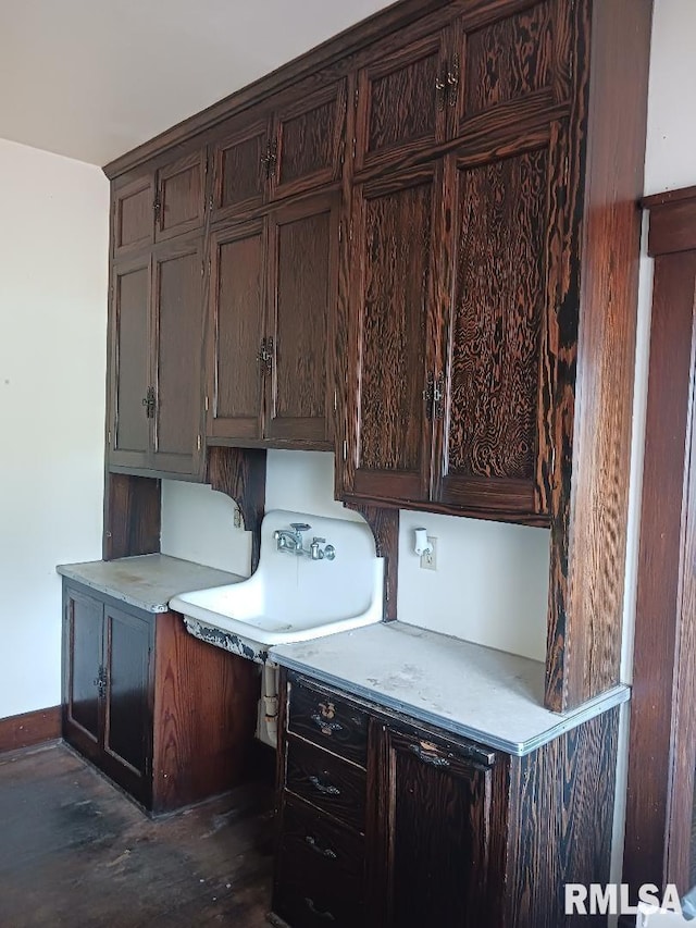 unfurnished office featuring dark hardwood / wood-style floors