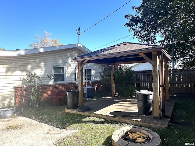 1911 Wall St, Murphysboro, IL 62966 - view of yard featuring a fire pit, fence, central AC unit, a patio area, and a gazebo