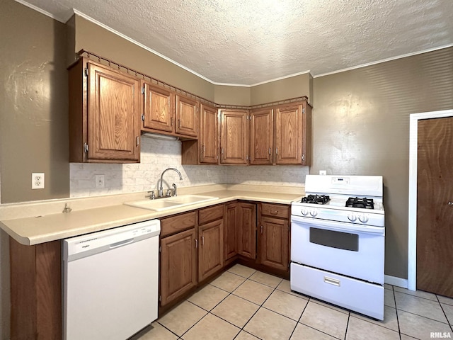 1911 Wall St, Murphysboro, IL 62966 - kitchen featuring a sink, a textured ceiling, white appliances, and ornamental molding