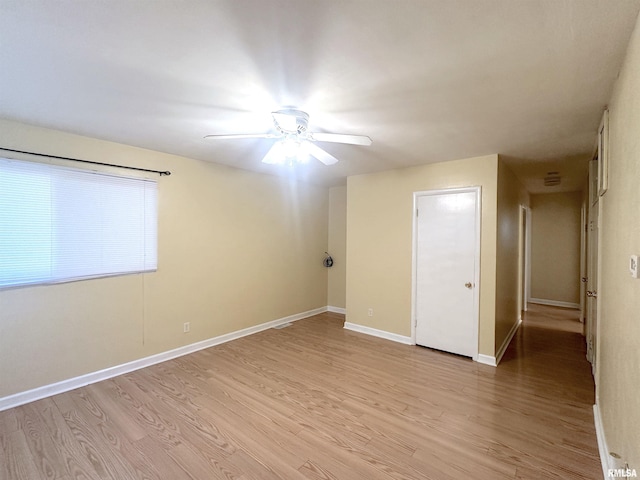 1911 Wall St, Murphysboro, IL 62966 - empty room with baseboards, ceiling fan, and light wood-style flooring