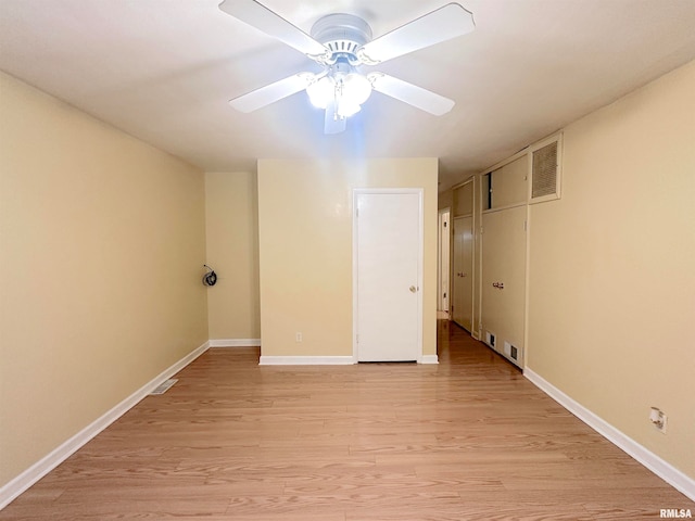 spare room with light hardwood / wood-style flooring and ceiling fan