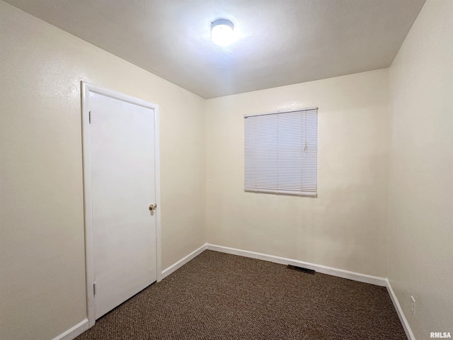 1911 Wall St, Murphysboro, IL 62966 - spare room featuring carpet floors and baseboards