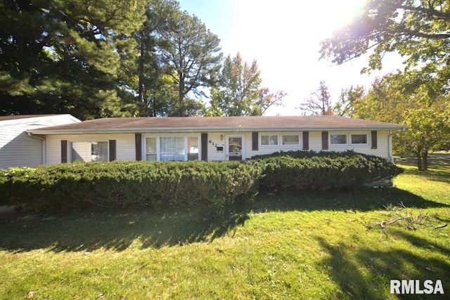 single story home featuring a front yard