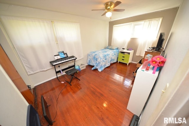 bedroom with hardwood / wood-style flooring and ceiling fan