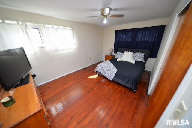 bedroom with wood-type flooring and ceiling fan