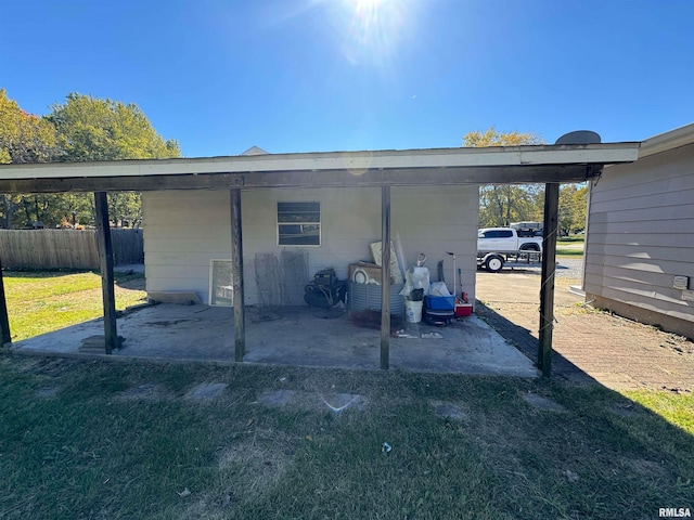 exterior space with a yard and a carport