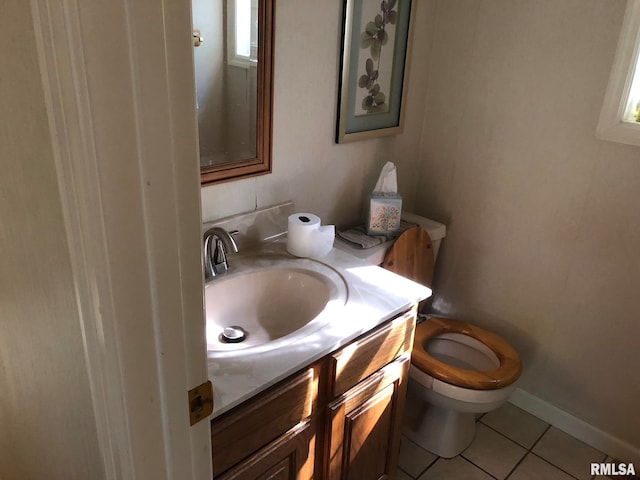 bathroom with vanity, toilet, and tile patterned flooring