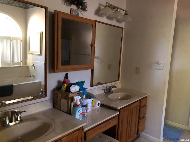 bathroom featuring vanity and a tub