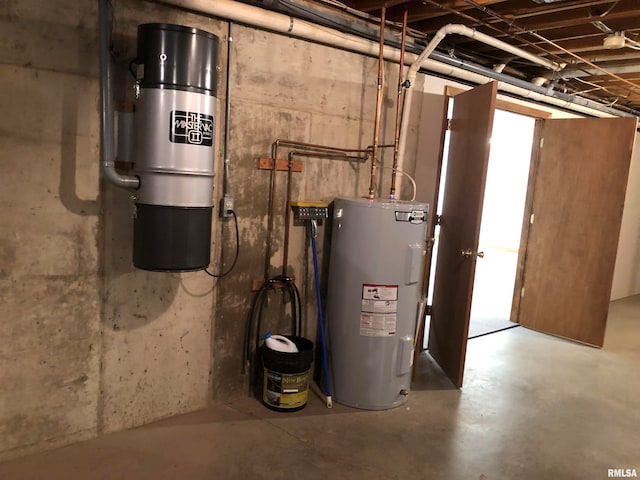 utility room featuring water heater