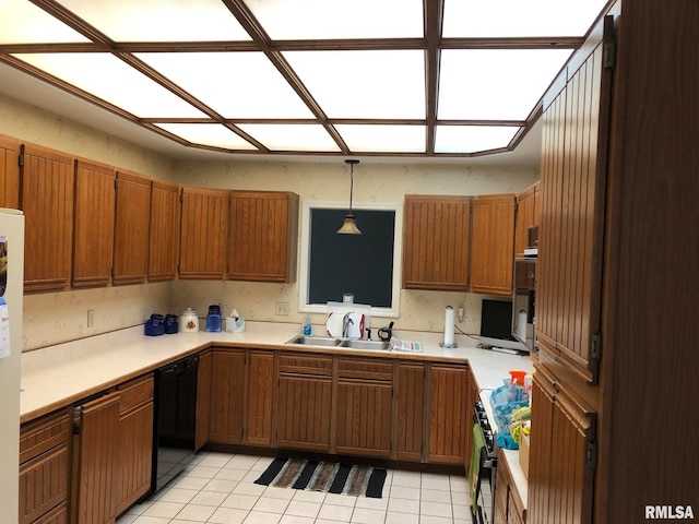 kitchen with range with gas cooktop, sink, light tile patterned flooring, dishwasher, and pendant lighting