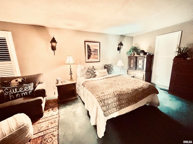 carpeted bedroom featuring a textured ceiling