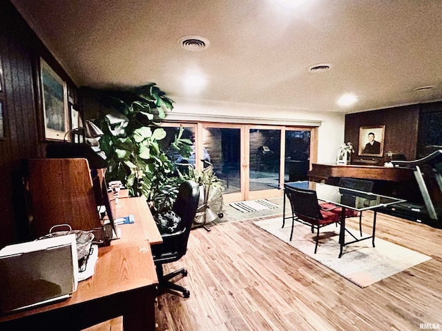 office space featuring hardwood / wood-style floors and a textured ceiling