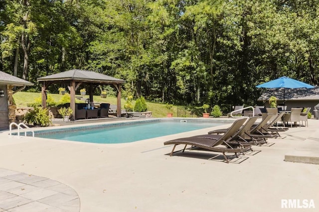 view of swimming pool with a gazebo and a patio area