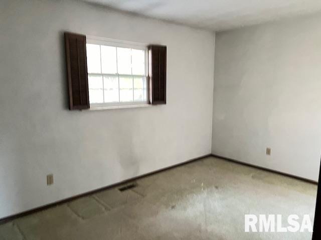 spare room with carpet floors