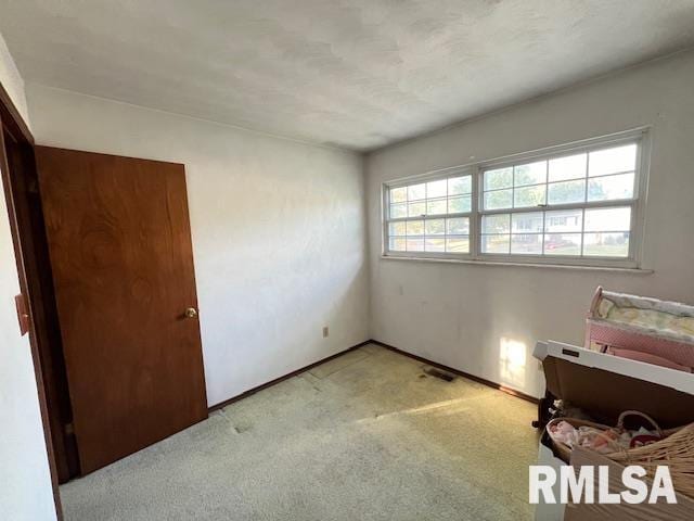 25 SW Crescent Rd, Mount Vernon, IL 62864 - unfurnished bedroom featuring light colored carpet and baseboards