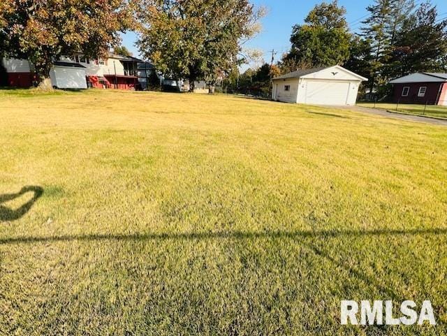 25 SW Crescent Rd, Mount Vernon, IL 62864 - view of green lawn with a garage and an outdoor structure