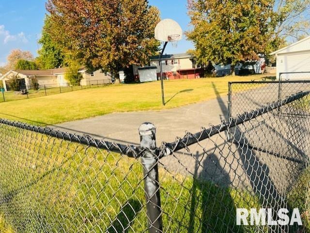 view of yard featuring basketball court