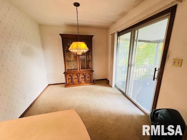 25 SW Crescent Rd, Mount Vernon, IL 62864 - unfurnished dining area featuring light colored carpet and wallpapered walls