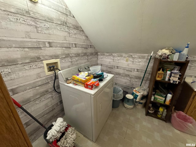 laundry room with washer / clothes dryer and wooden walls