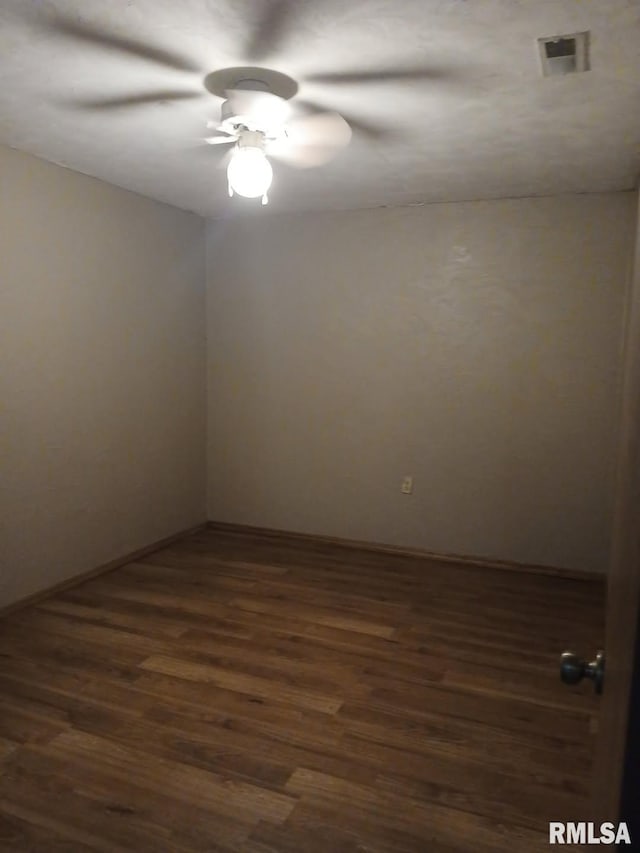 9735 Branch Rd, Oakdale, IL 62268 - empty room featuring dark wood-style floors, ceiling fan, and visible vents