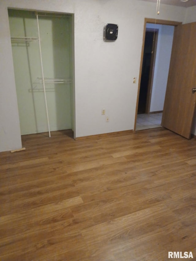 9735 Branch Rd, Oakdale, IL 62268 - unfurnished bedroom featuring a closet and wood finished floors