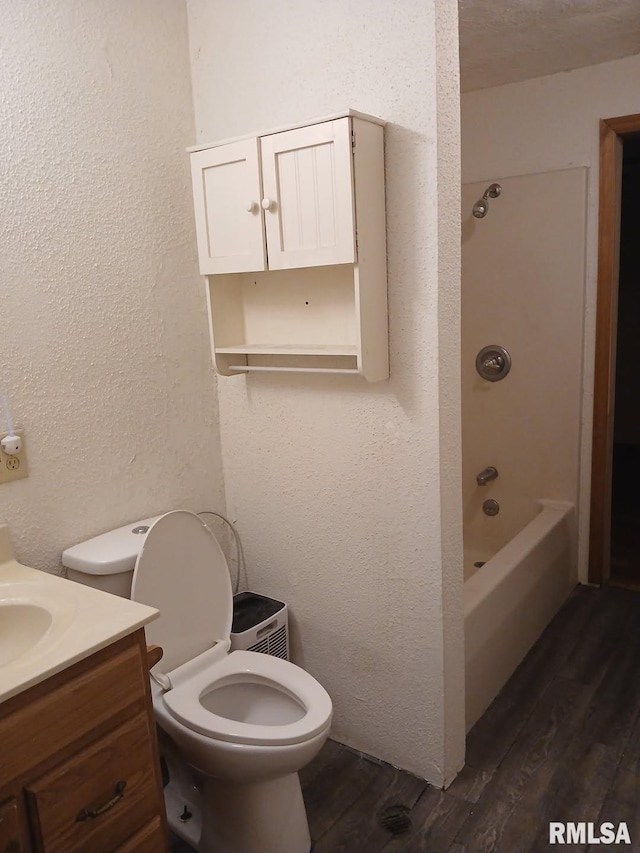 9735 Branch Rd, Oakdale, IL 62268 - bathroom featuring toilet, vanity, wood finished floors, and a textured wall