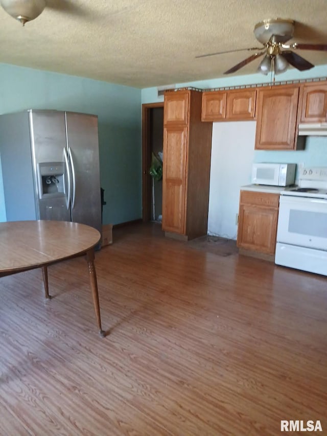 9735 Branch Rd, Oakdale, IL 62268 - kitchen with white appliances, ventilation hood, and wood finished floors