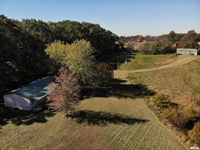 birds eye view of property with a rural view