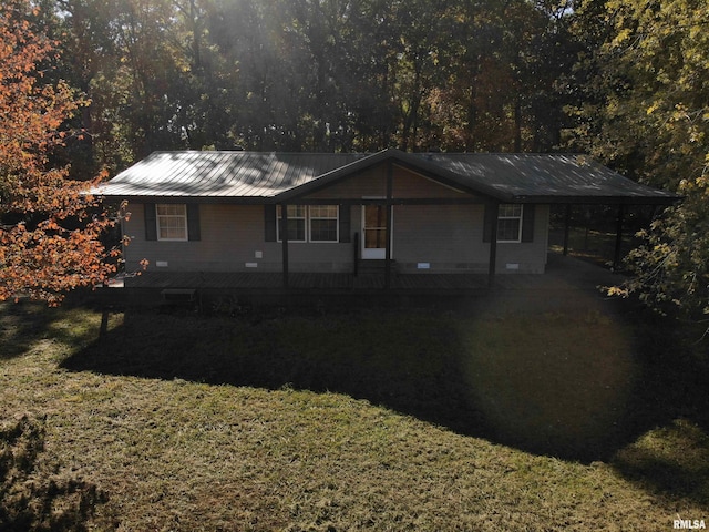 single story home with a front yard and a carport