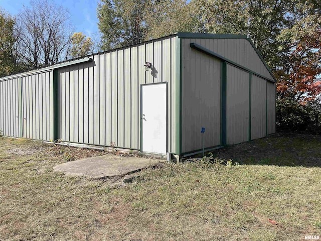 view of outbuilding featuring a lawn