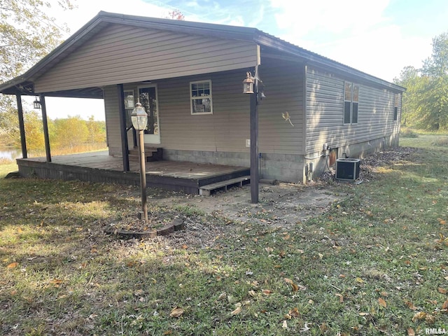 view of property exterior featuring a yard and cooling unit