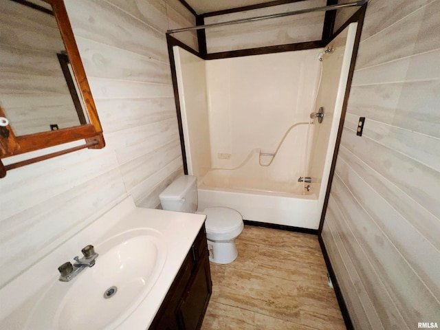 full bathroom with vanity, toilet, shower / bathtub combination, and tile walls