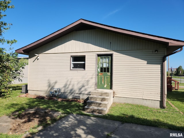 view of property exterior with a yard