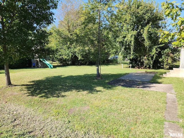 view of yard with a playground